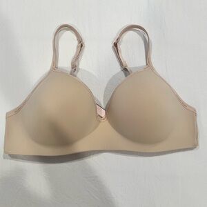 Nude Victoria’s Secret wireless bra.